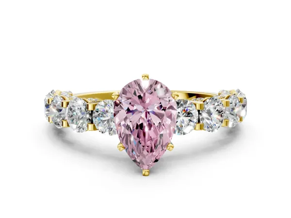Fancy Pink Pear Cut Diamond Side Stone Engagement Ring with Four-Prong Setting Yellow gold