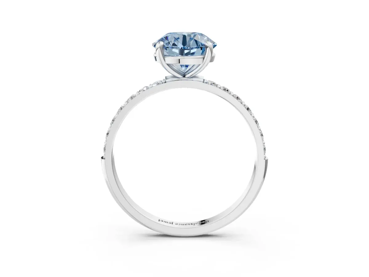 Fancy Blue Round Cut Diamond Solitaire Ring with Round Pavé Band and Prong Setting Silver