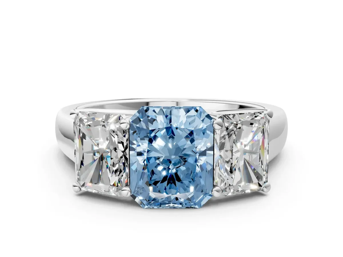 Fancy Blue Radiant Cut Three-Stone Diamond Ring with Prong Setting on a Classic Band Platinum