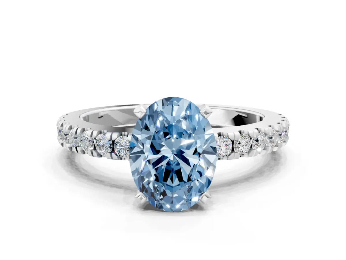 Fancy Blue Oval Cut Solitaire Diamond with Pavé Band and Four-Prong Setting Silver