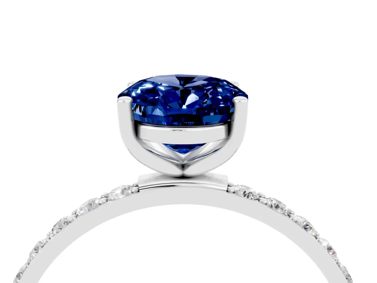 Oval Cut Blue Sapphire Solitaire Ring with Round Pavé Band and Prong Setting Silver