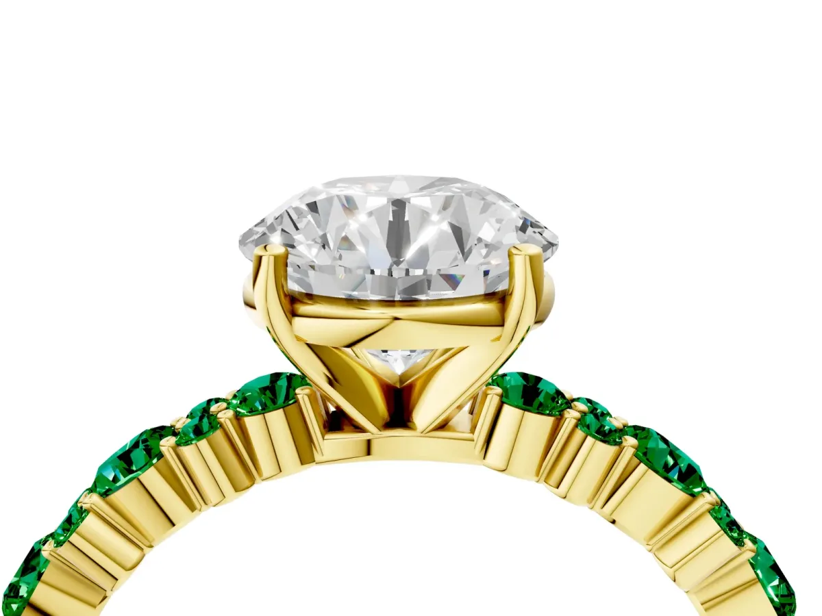 Round Cut Diamond Side Stone Solitaire Ring with Round Emerald and Four-Prong Setting Yellow gold