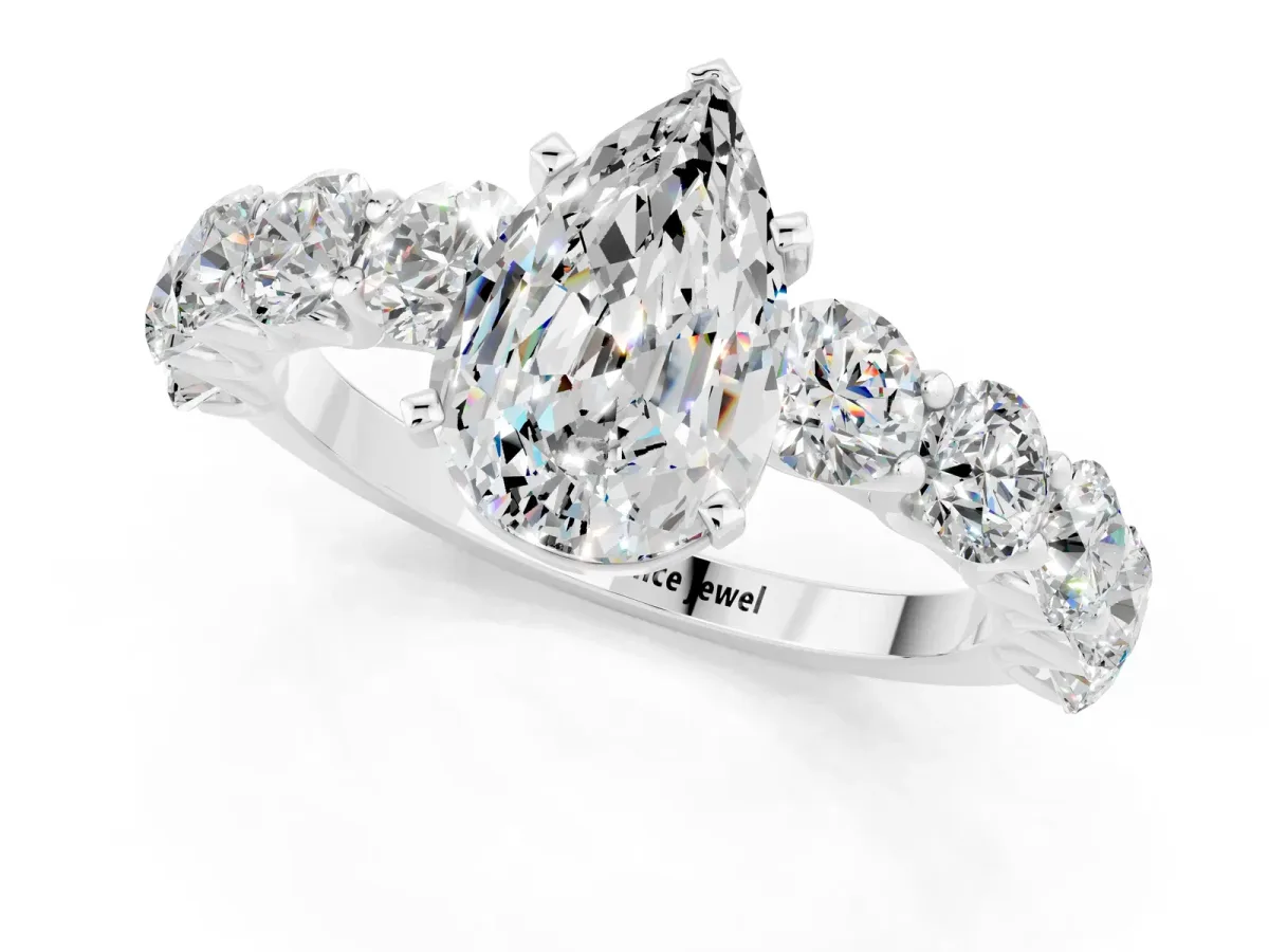 Pear Cut Moissanite Prong Setting with Side Stones on a Pave Band Silver