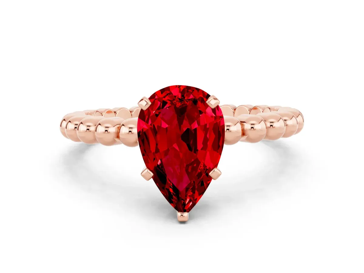 Pear Cut Ruby Solitaire Ring with Beaded Band and Prong Setting Rose gold
