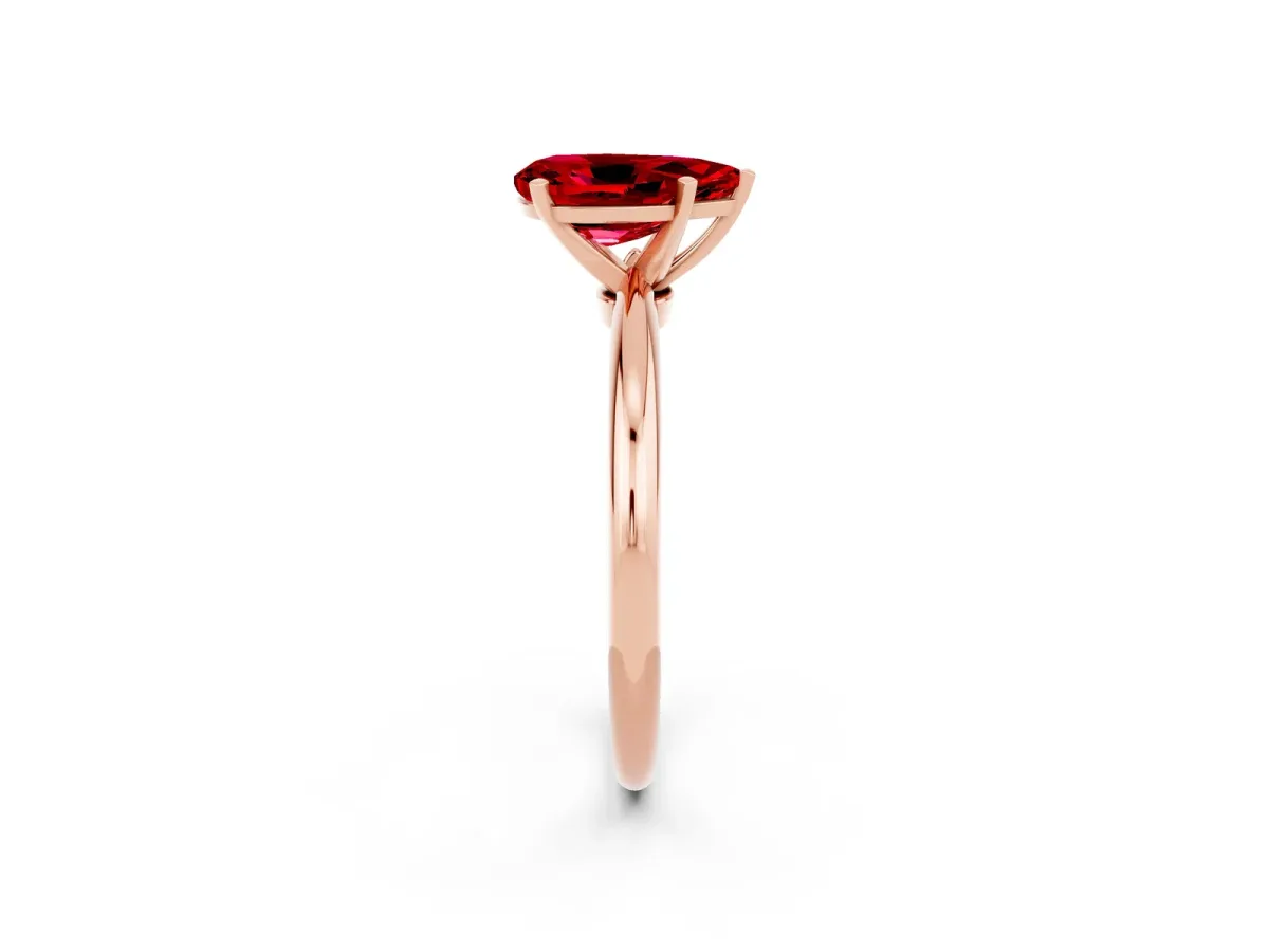 Pear Cut Ruby Solitaire Ring with Six-Prong Setting and Classic Band Rose gold