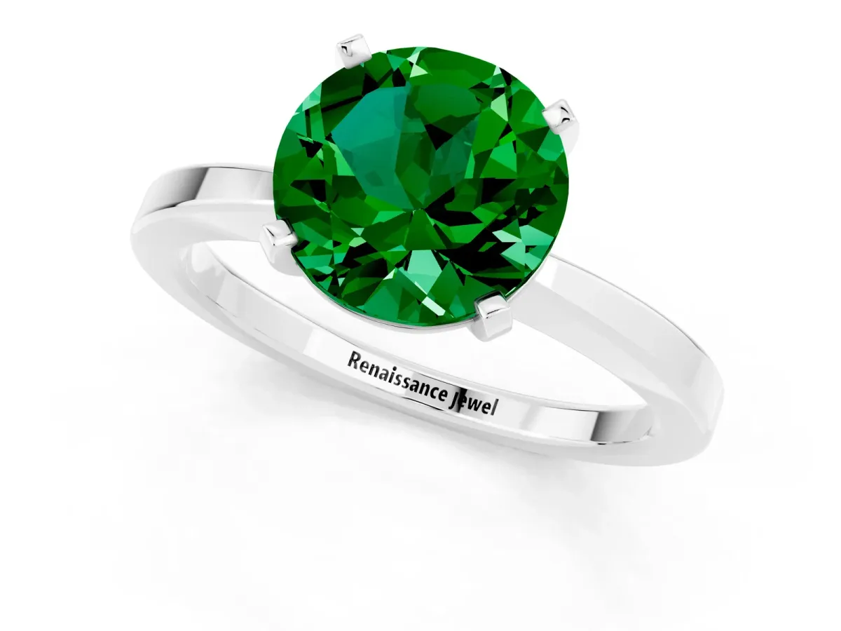 Round Cut Emerald Solitaire Engagement Ring with Classic Band and Four-Prong Setting Silver
