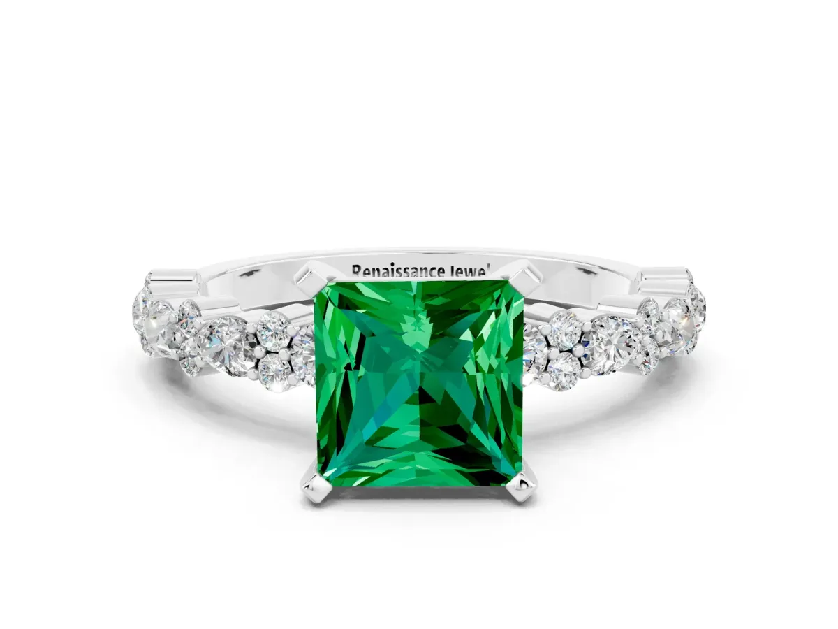 Princess Cut Emerald Side Stone Solitaire Ring with Round and Four-Prong Setting Silver