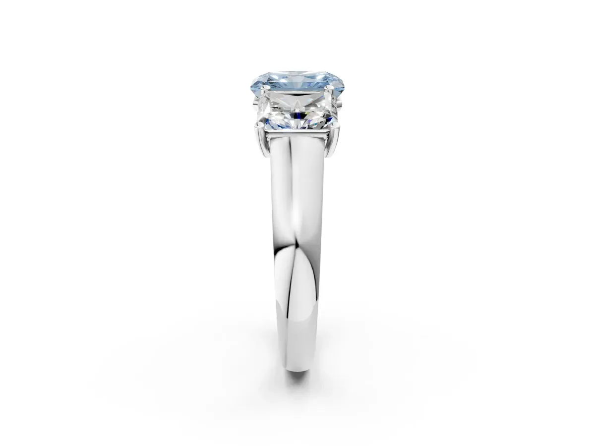Fancy Blue Radiant Cut Three-Stone Diamond Ring with Prong Setting on a Classic Band Platinum