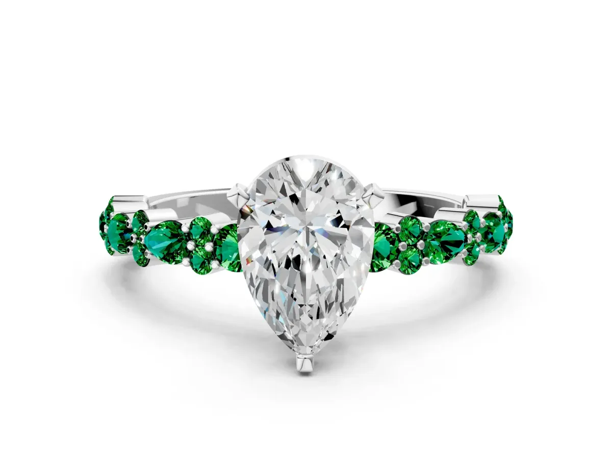 Pear Cut Diamond Side Stone Solitaire Ring with Round Emerald and Four-Prong Setting Silver