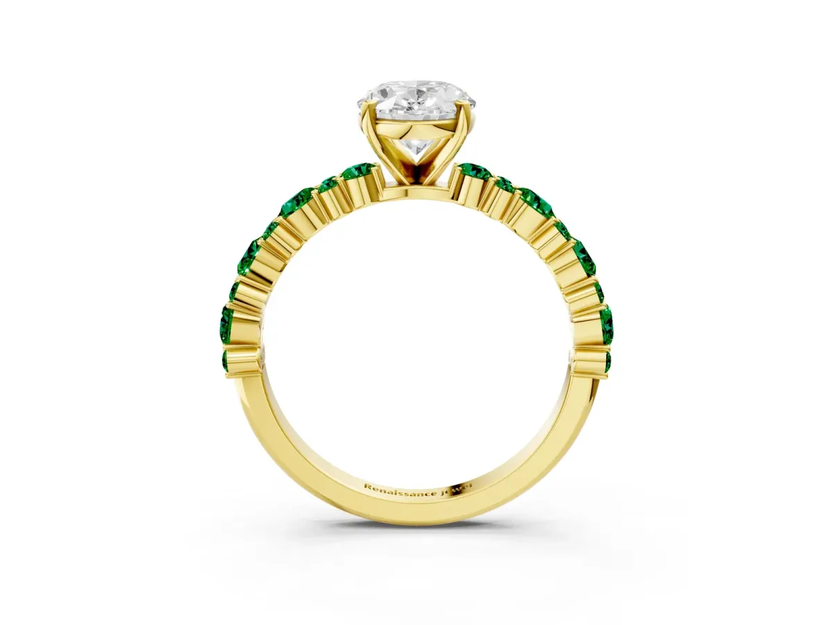 Oval Cut Diamond Side Stone Solitaire Ring with Round Emerald and Four-Prong Setting Yellow gold