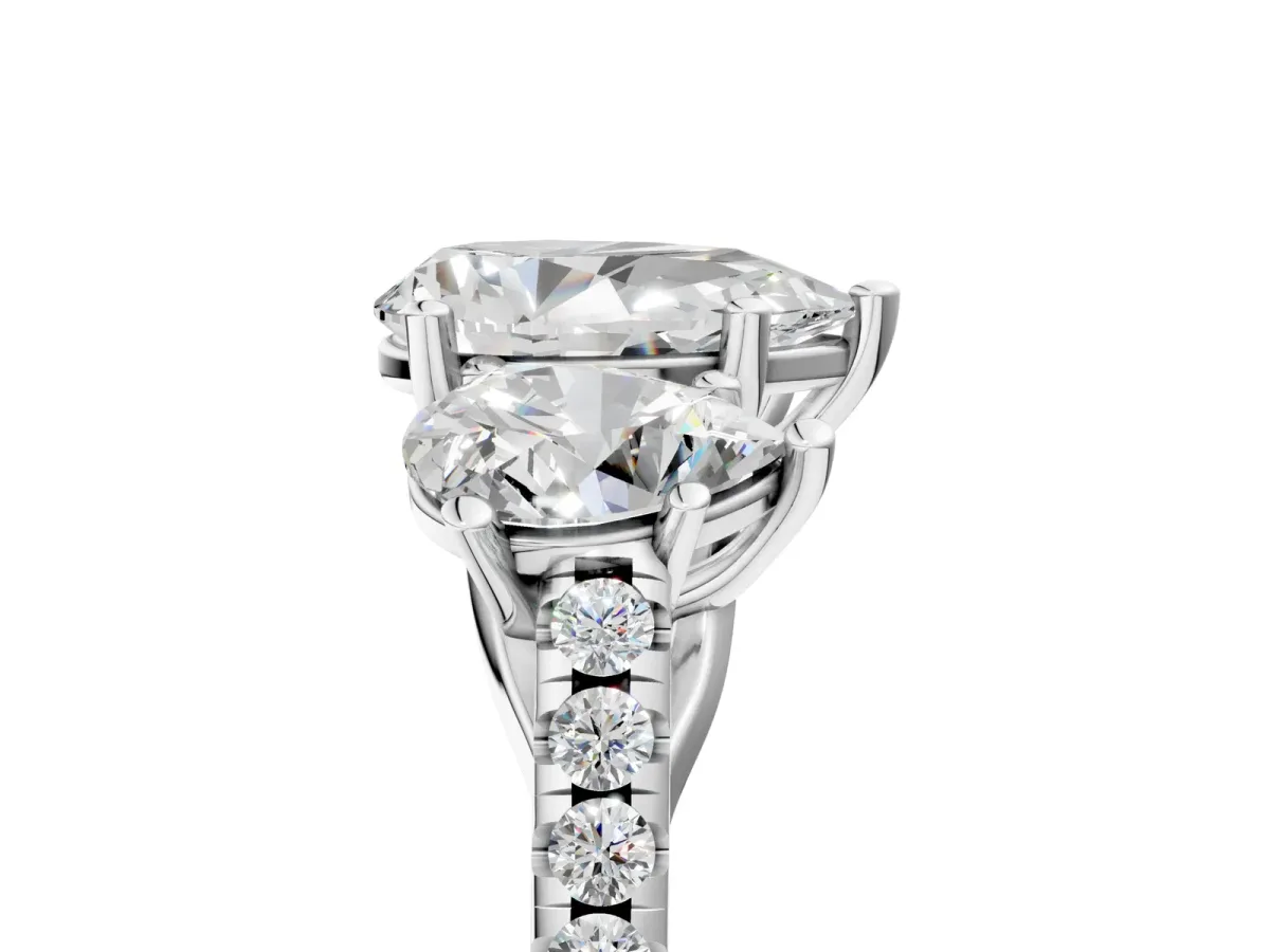 Three-Stone Pear Cut Diamond Ring with Round Pavé Band and Prong Setting White gold