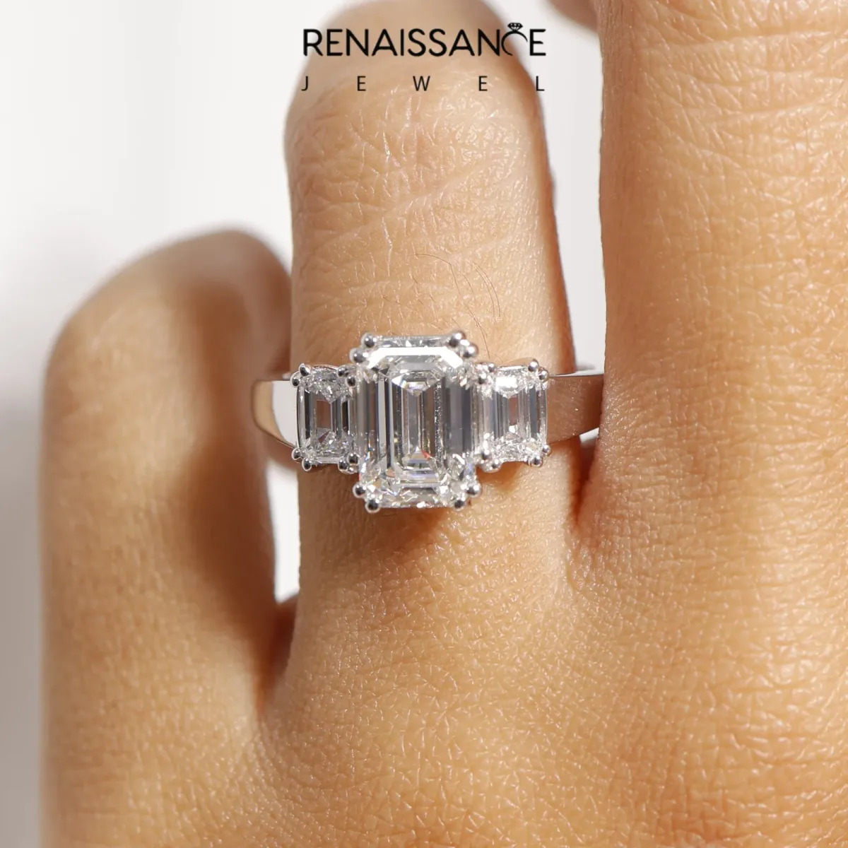 Three-Stone Oval Cut Cut Diamond Ring with Channel Set Band and Four-Prong Setting Silver