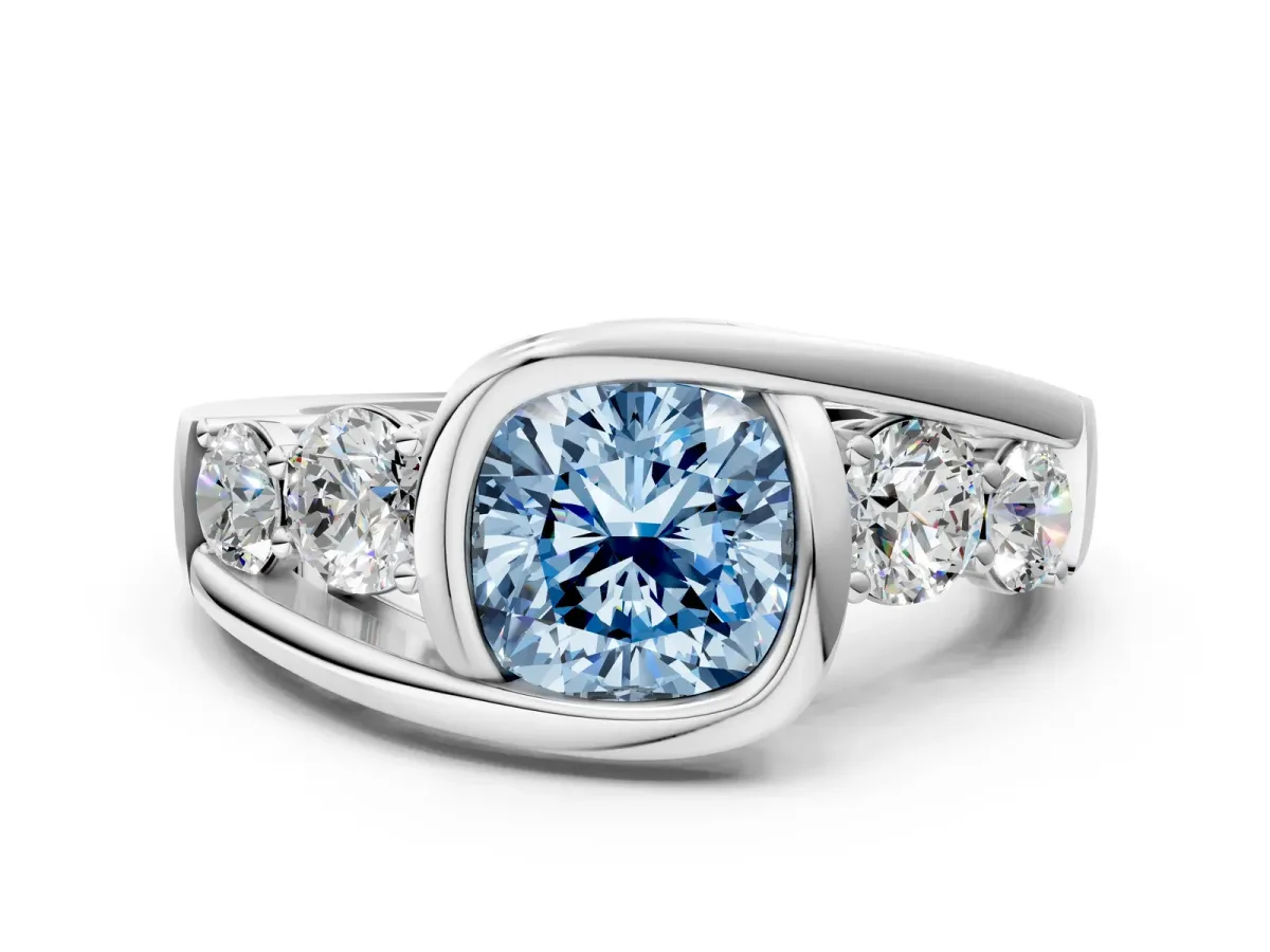 Fancy Blue Bezel Set Cushion Cut Diamond Bypass Ring with Round Accents Platinum