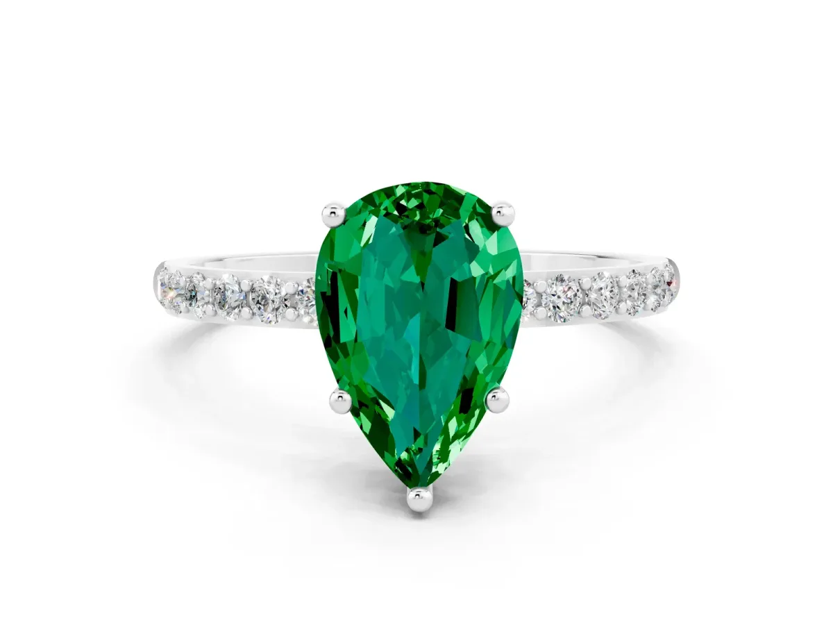 Pear Cut Emerald Solitaire Ring with Round Pavé Band and Prong Setting White gold