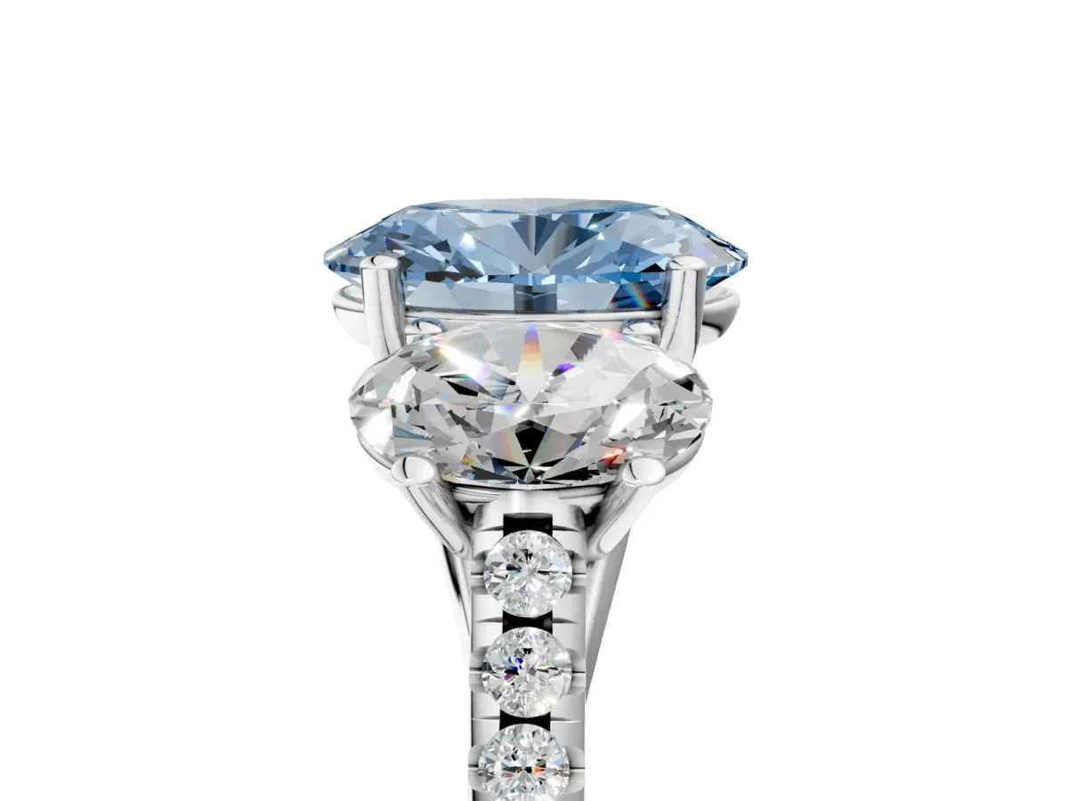 Fancy Blue Three-Stone Oval Cut Diamond Ring with Round Pavé Band and Prong Setting Platinum