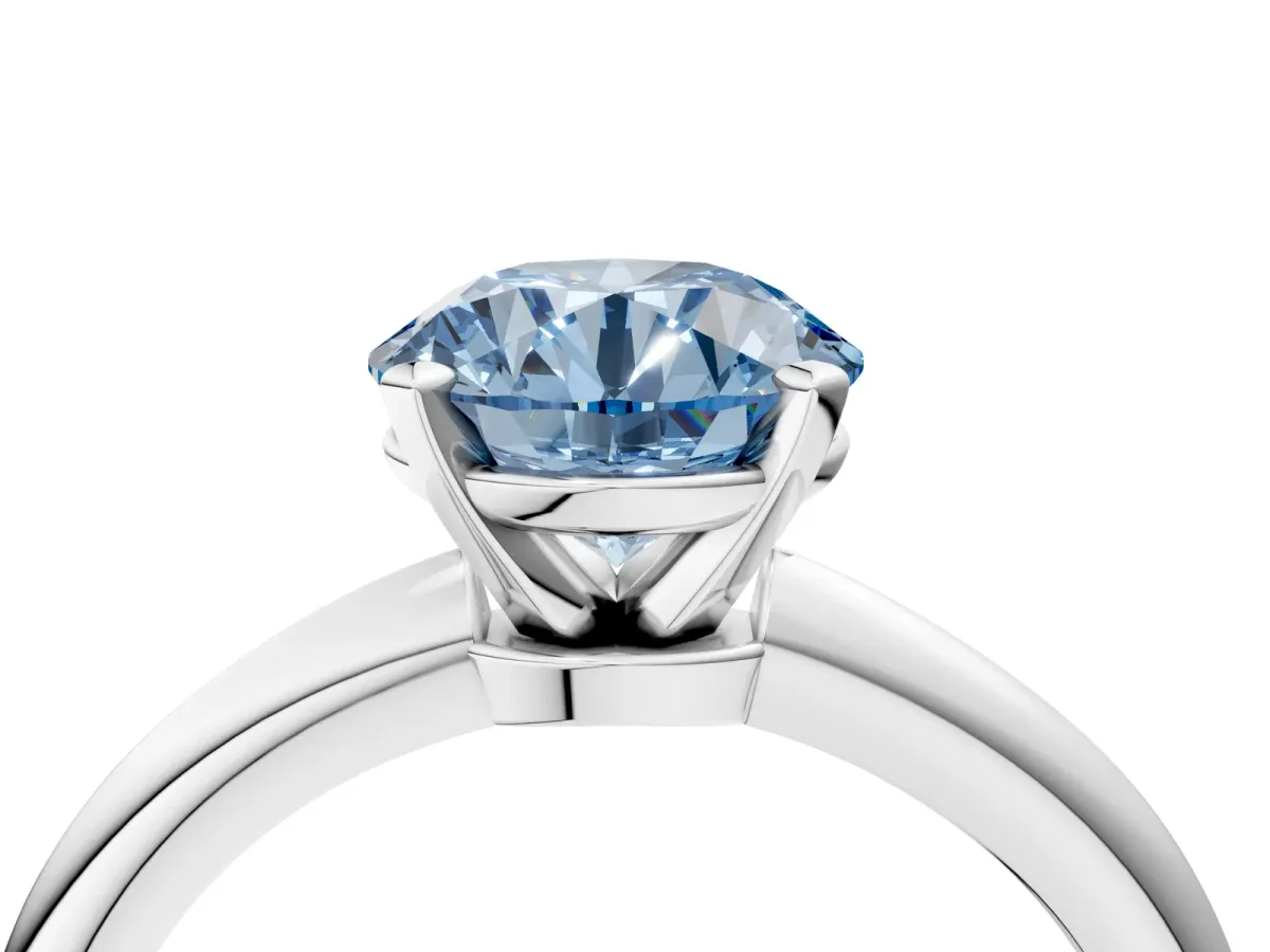 Fancy Blue Round Cut Diamond Solitaire Ring with Six-Prong Setting and Classic Band Silver