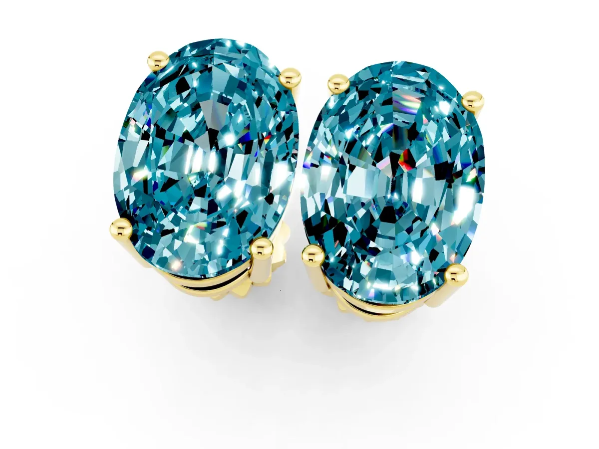 Oval Cut Blue Topaz Stud Earrings Yellow gold