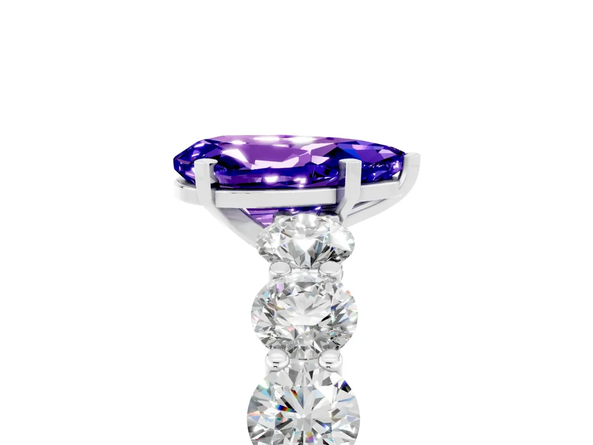 Pear Cut Tanzanite Prong Setting with Side Stones on a Pave Band Platinum