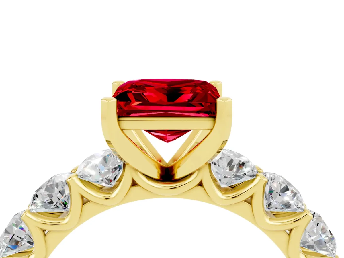 Princess Cut Ruby Prong Setting with Side Stones on a Pave Band Yellow gold