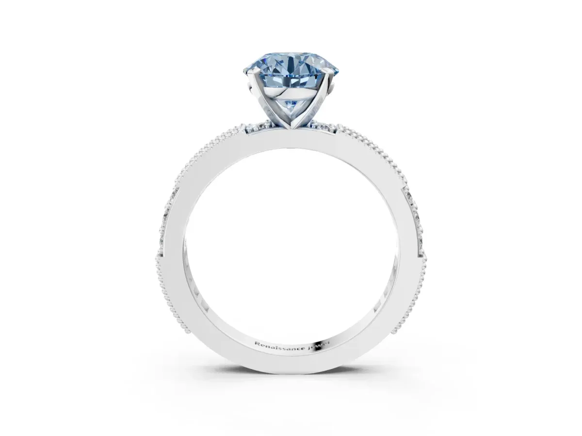 Fancy Blue Round Cut Solitaire with Pavé Band and Four-Prong Setting Silver