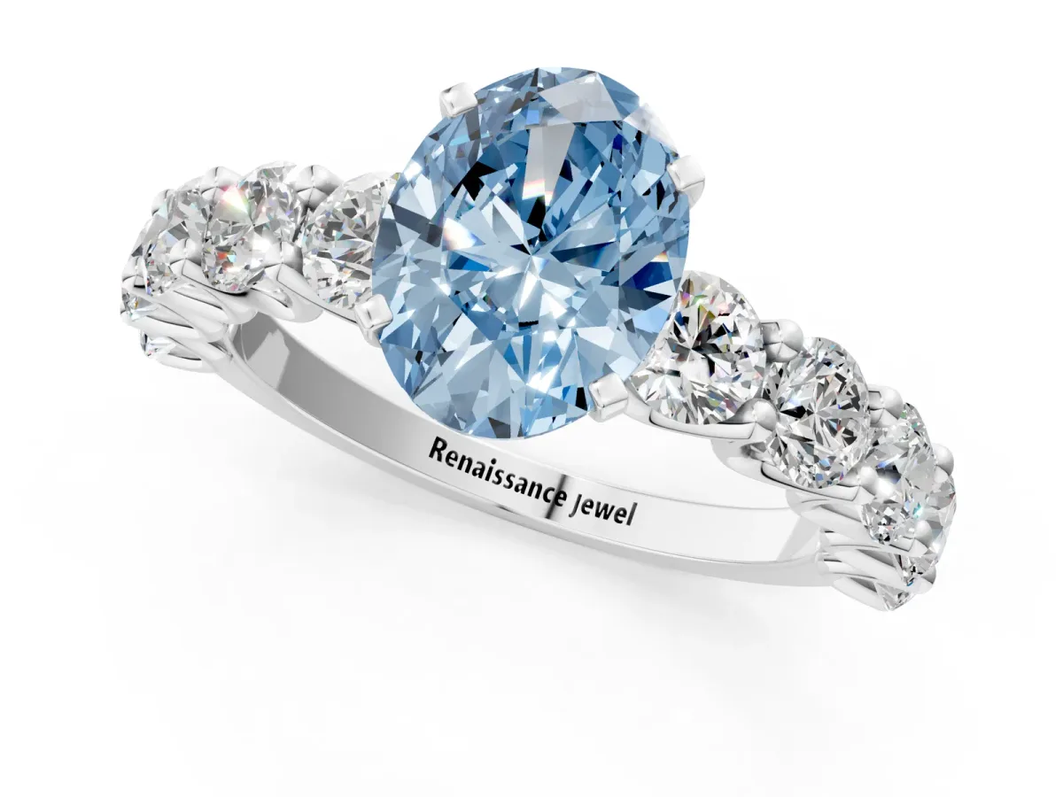 Fancy Blue Oval Cut Diamond Prong Setting with Side Stones on a Pave Band Platinum