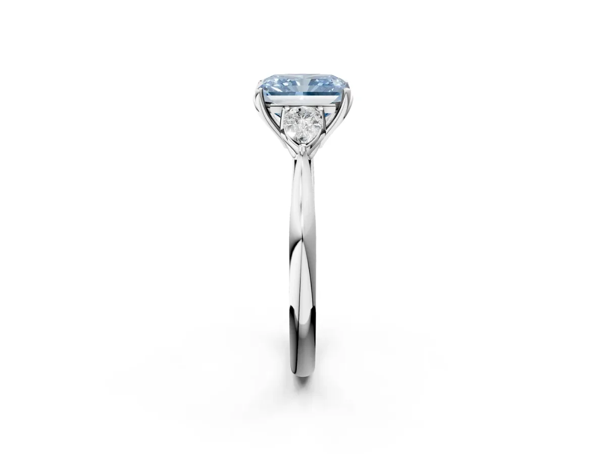 Fancy Blue Three-Stone Radiant Cut Diamond Ring with Pear Side Stones in Four-Prong Setting Platinum