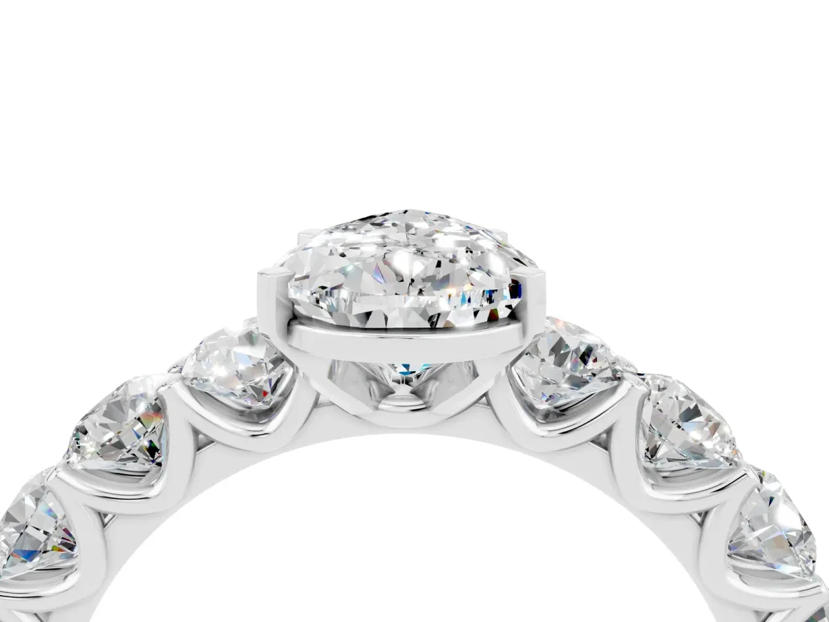Pear Cut Moissanite Prong Setting with Side Stones on a Pave Band Silver