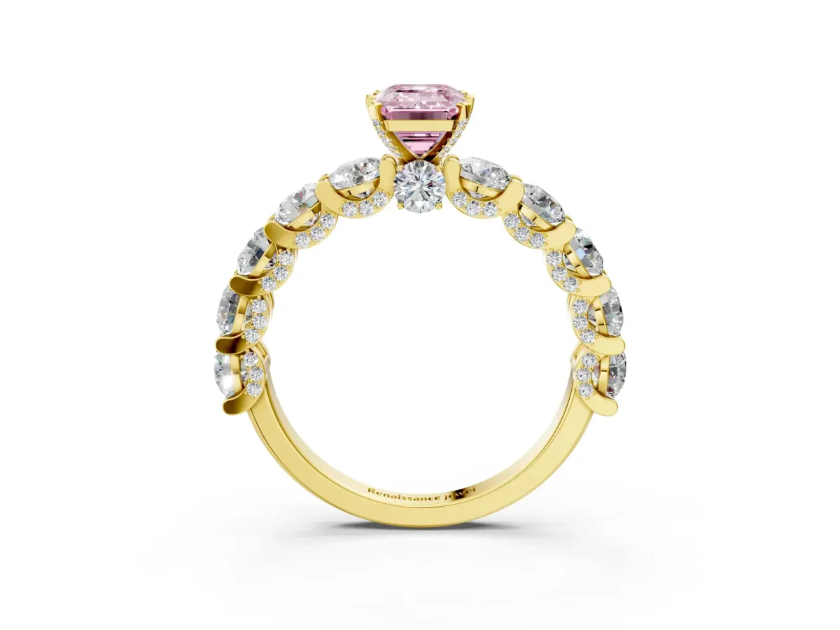 Fancy Pink Emerald Cut Diamond Side Stone Engagement Ring with Four-Prong Setting Yellow gold