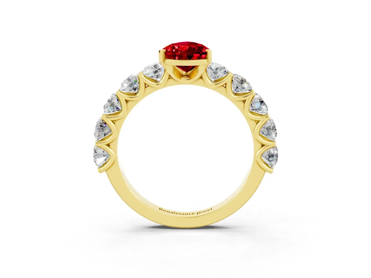 Pear Cut Ruby Prong Setting with Side Stones on a Pave Band Yellow gold