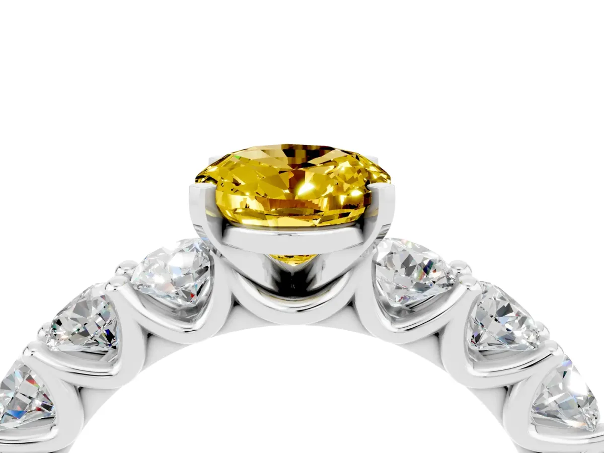 Oval Cut Yellow Sapphire Prong Setting with Side Stones on a Pave Band Silver