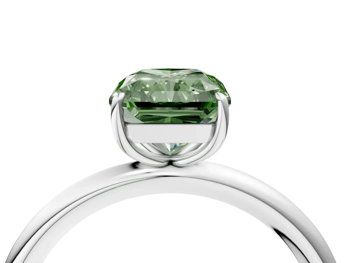 Fancy Green Radiant Cut Solitaire Diamond Ring with Four-Prong Setting on a Plain Band Platinum