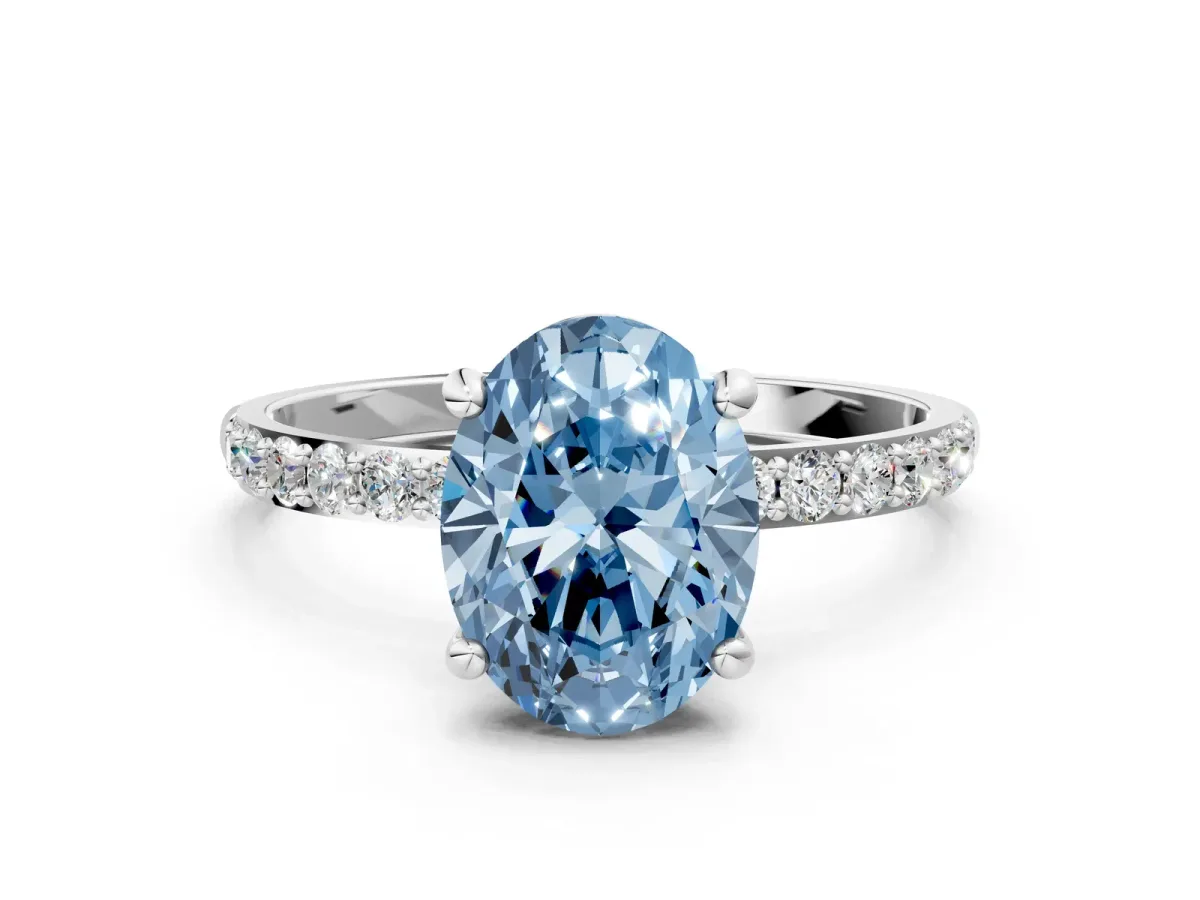Fancy Blue Oval Cut Diamond Solitaire Ring with Round Pavé Band and Prong Setting Silver