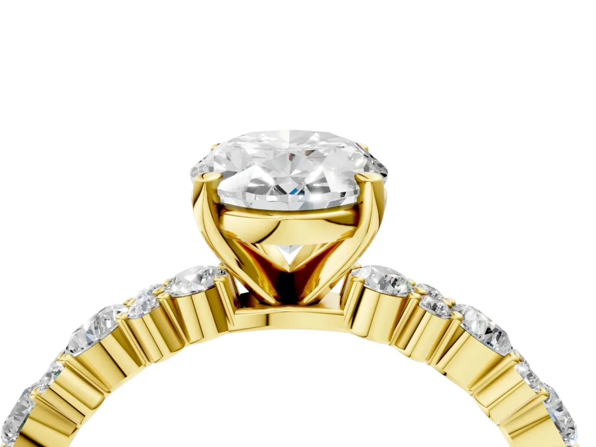 Oval Cut Diamond Side Stone Solitaire Ring with Round and Four-Prong Setting Yellow gold