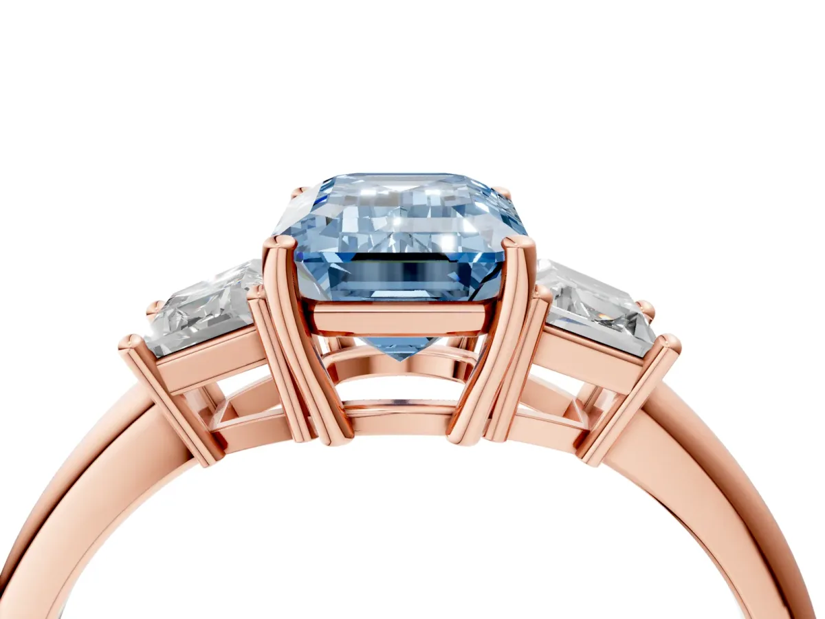 Fancy Blue Emerald Cut Diamond Three-Stone Ring with Trapezoid Side Stones and Prong Setting Rose gold