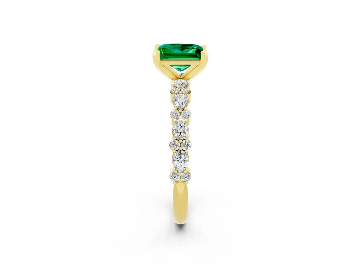 Princess Cut Emerald Side Stone Solitaire Ring with Round and Four-Prong Setting Yellow gold