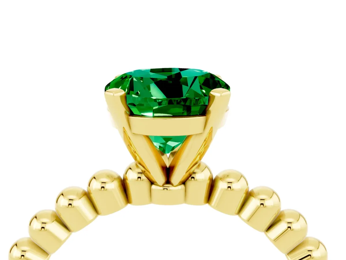 Round Cut Emerald Solitaire Ring with Beaded Band and Prong Setting Yellow gold
