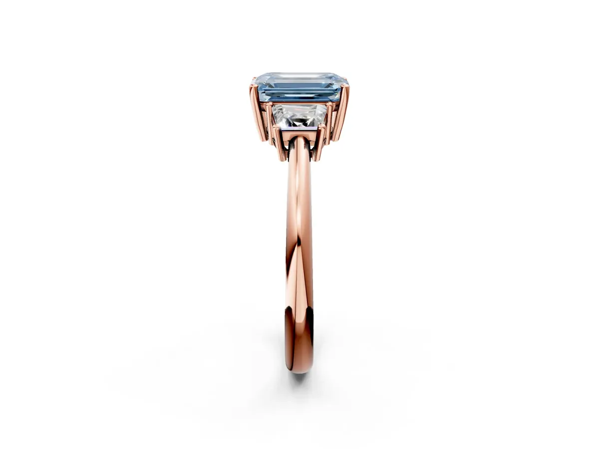 Fancy Blue Emerald Cut Diamond Three-Stone Ring with Trapezoid Side Stones and Prong Setting Rose gold