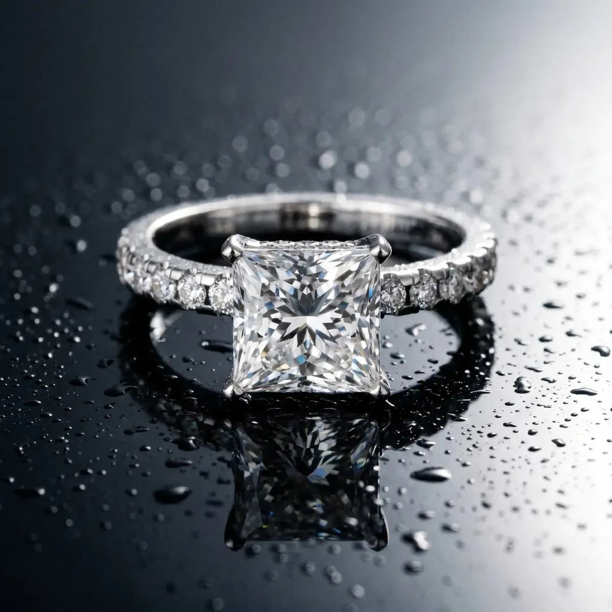 Princess Cut Diamond Solitaire Ring with Round Pavé Band and Four-Prong Setting Silver