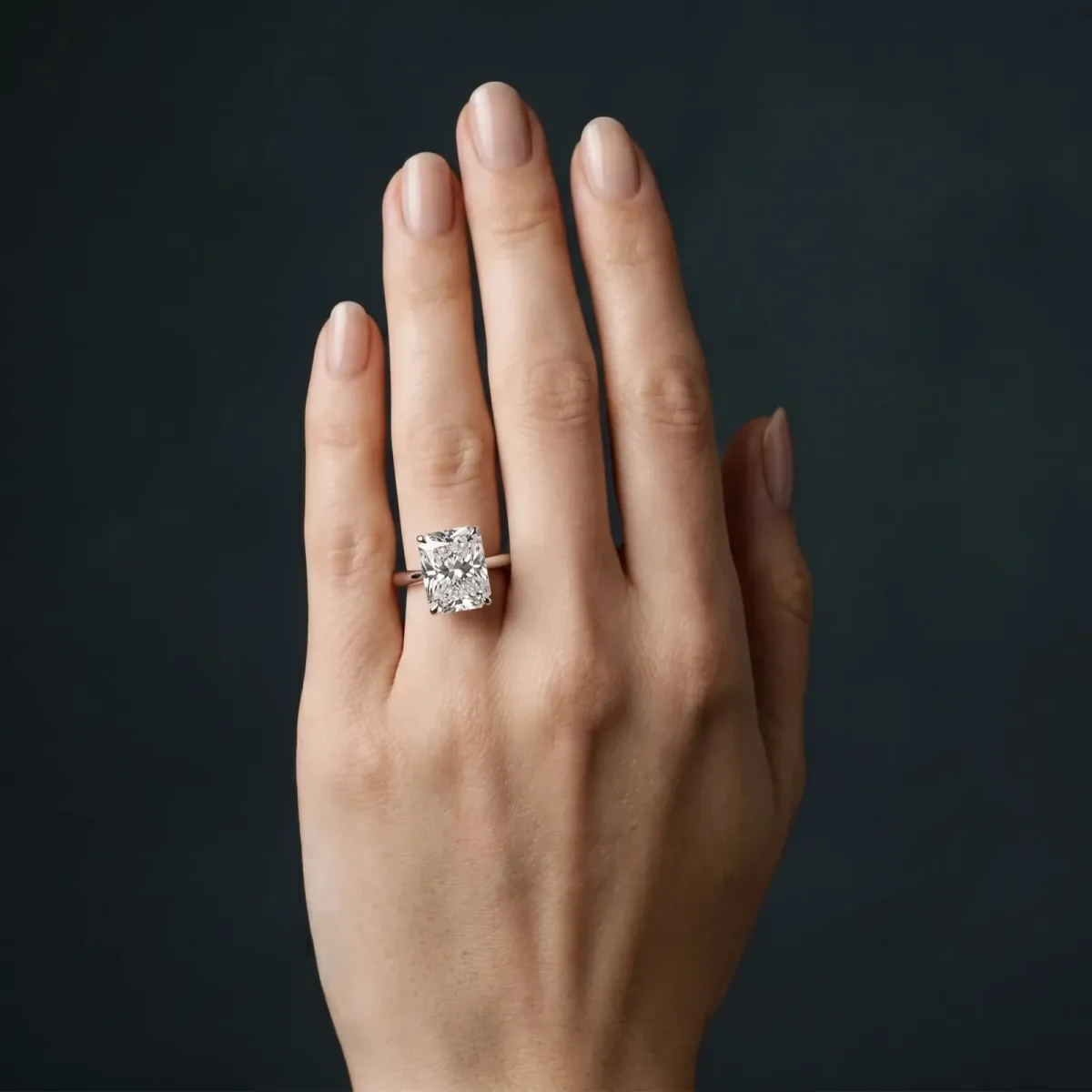 Radiant Cut Cut Solitaire Ring with Cathedral Band and Four-Prong Setting Platinum