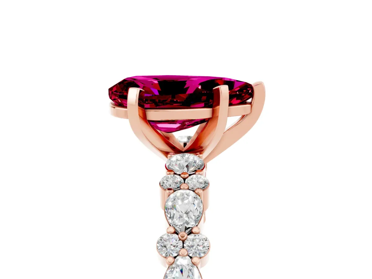 Pear Cut Garnet Side Stone Solitaire Ring with Round and Four-Prong Setting Rose gold