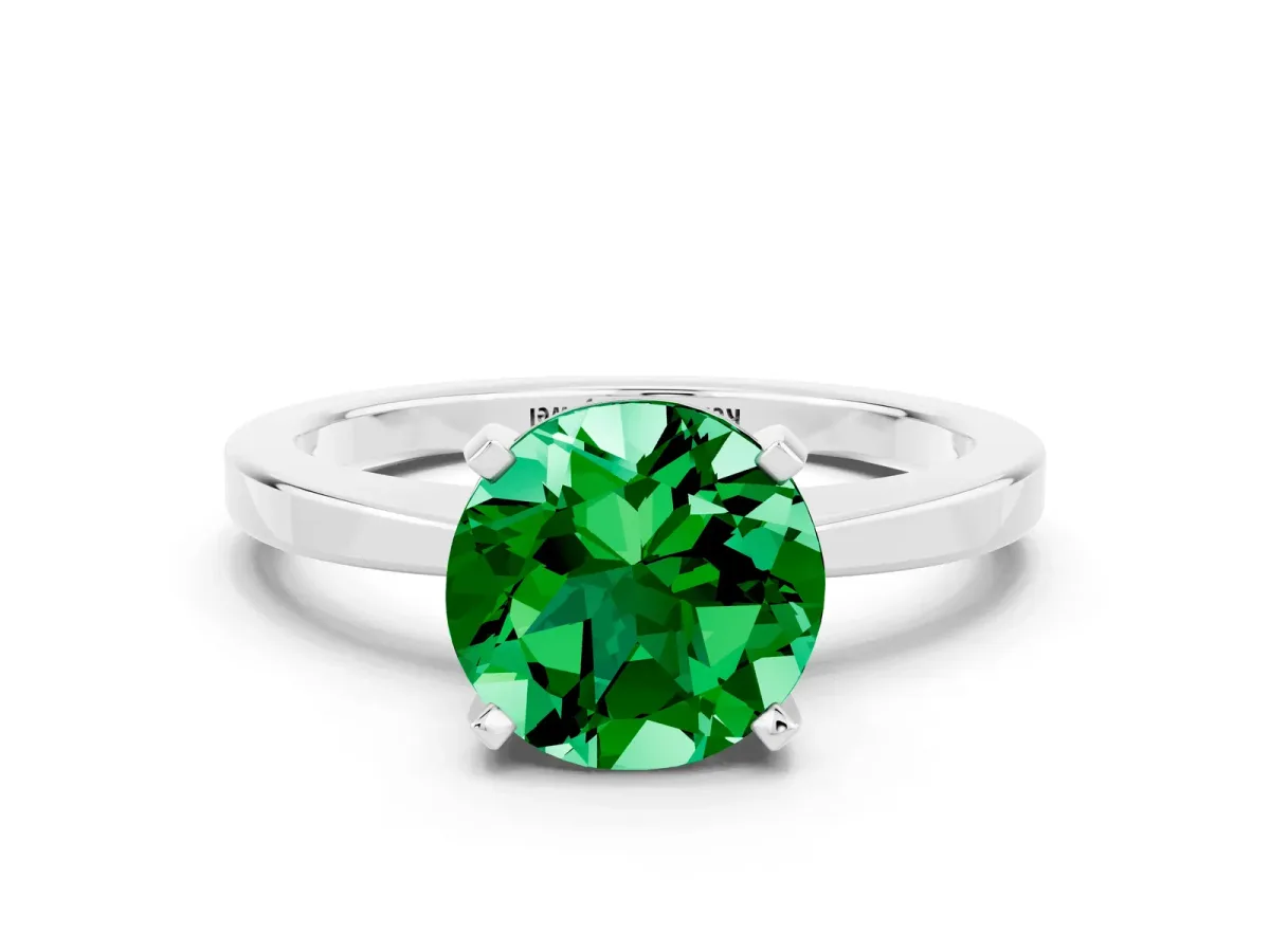 Round Cut Emerald Solitaire Engagement Ring with Classic Band and Four-Prong Setting Silver