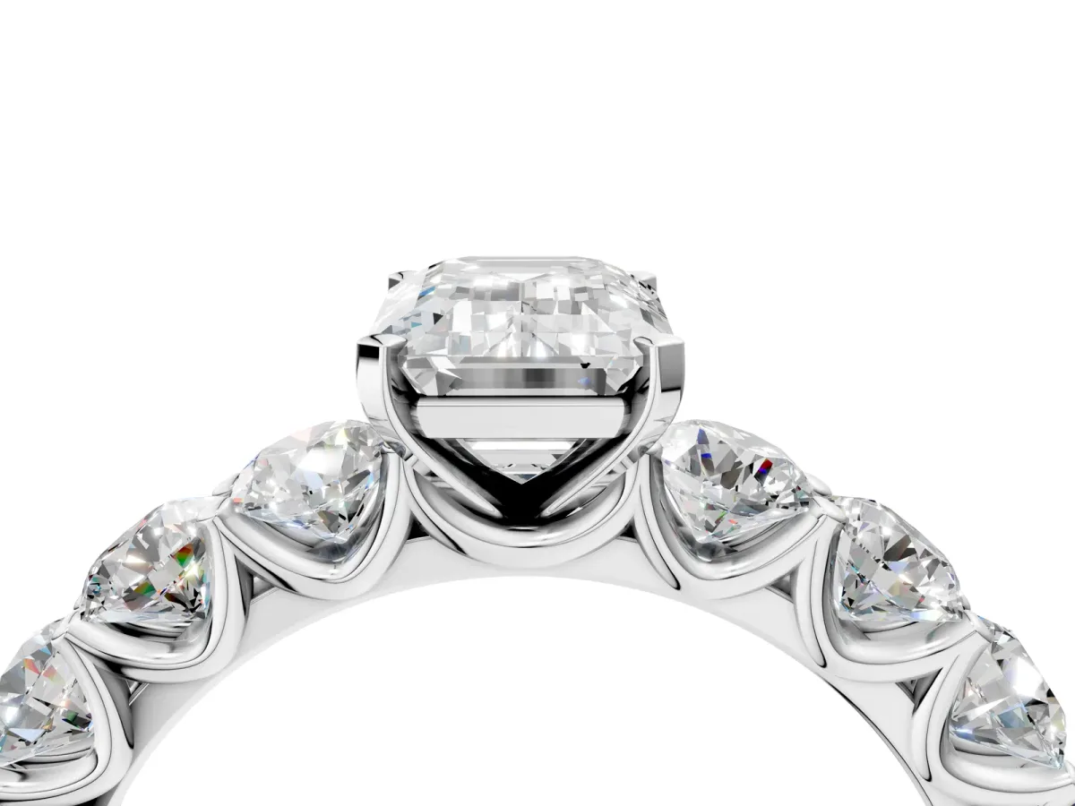 Emerald Cut Diamond Prong Setting with Side Stones on a Pave Band Silver
