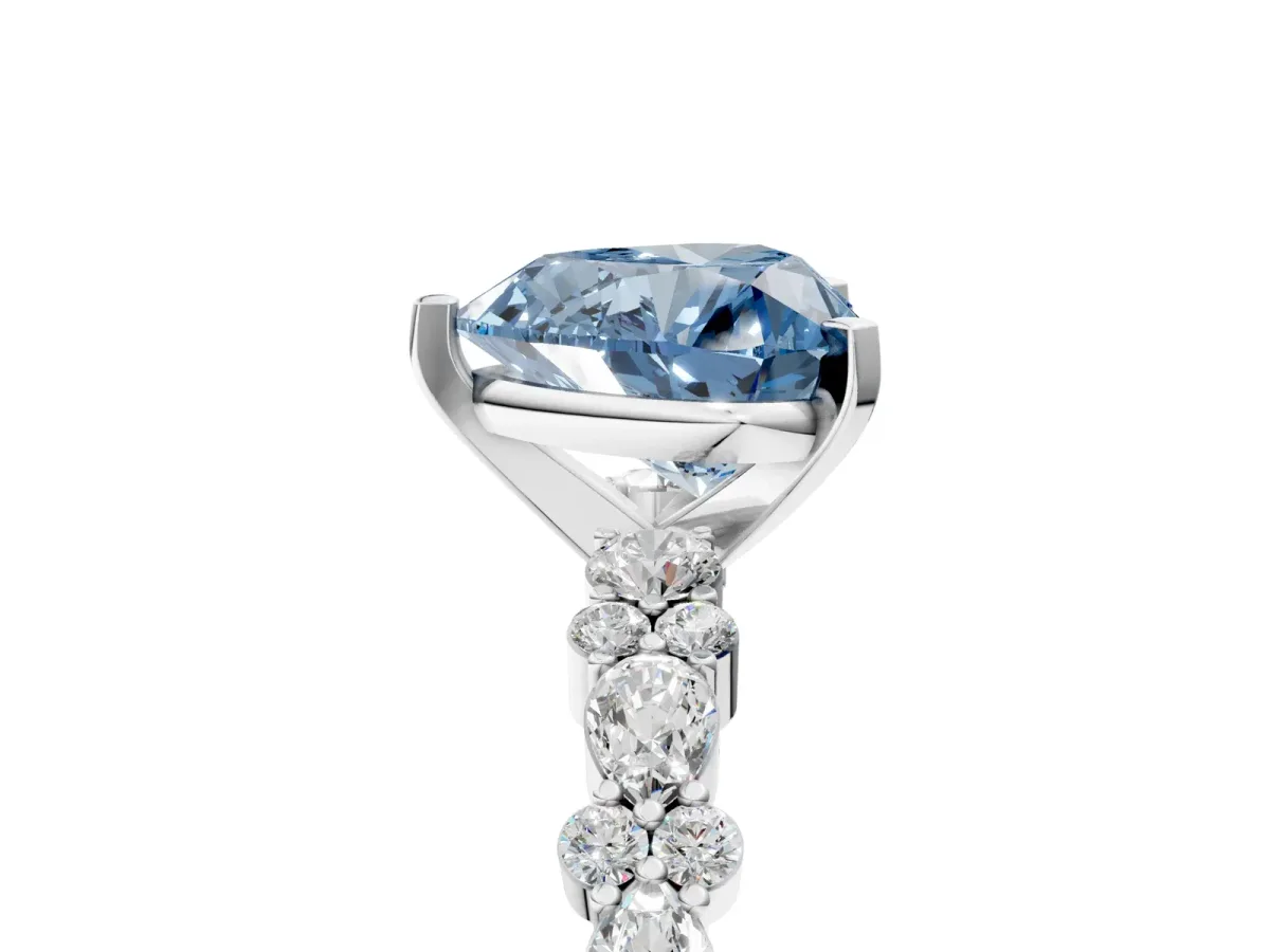 Fancy Blue Heart Cut Diamond Side Stone Solitaire Ring with Round and Four-Prong Setting Silver