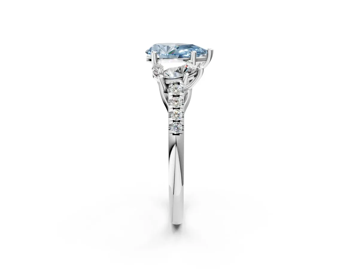 Fancy Blue Three-Stone Pear Cut Diamond Ring with Round Pavé Band and Prong Setting Platinum