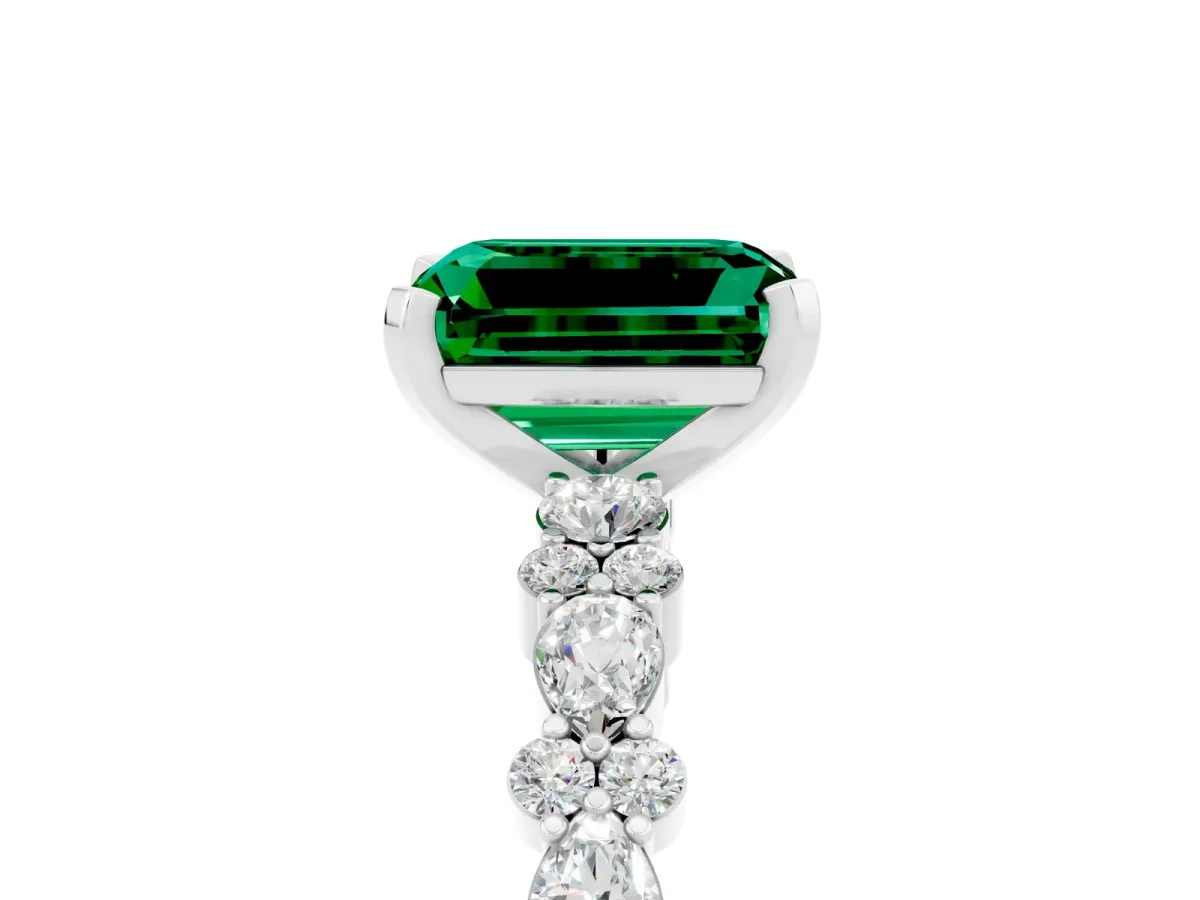 Emerald Cut Emerald Side Stone Solitaire Ring with Round and Four-Prong Setting Silver