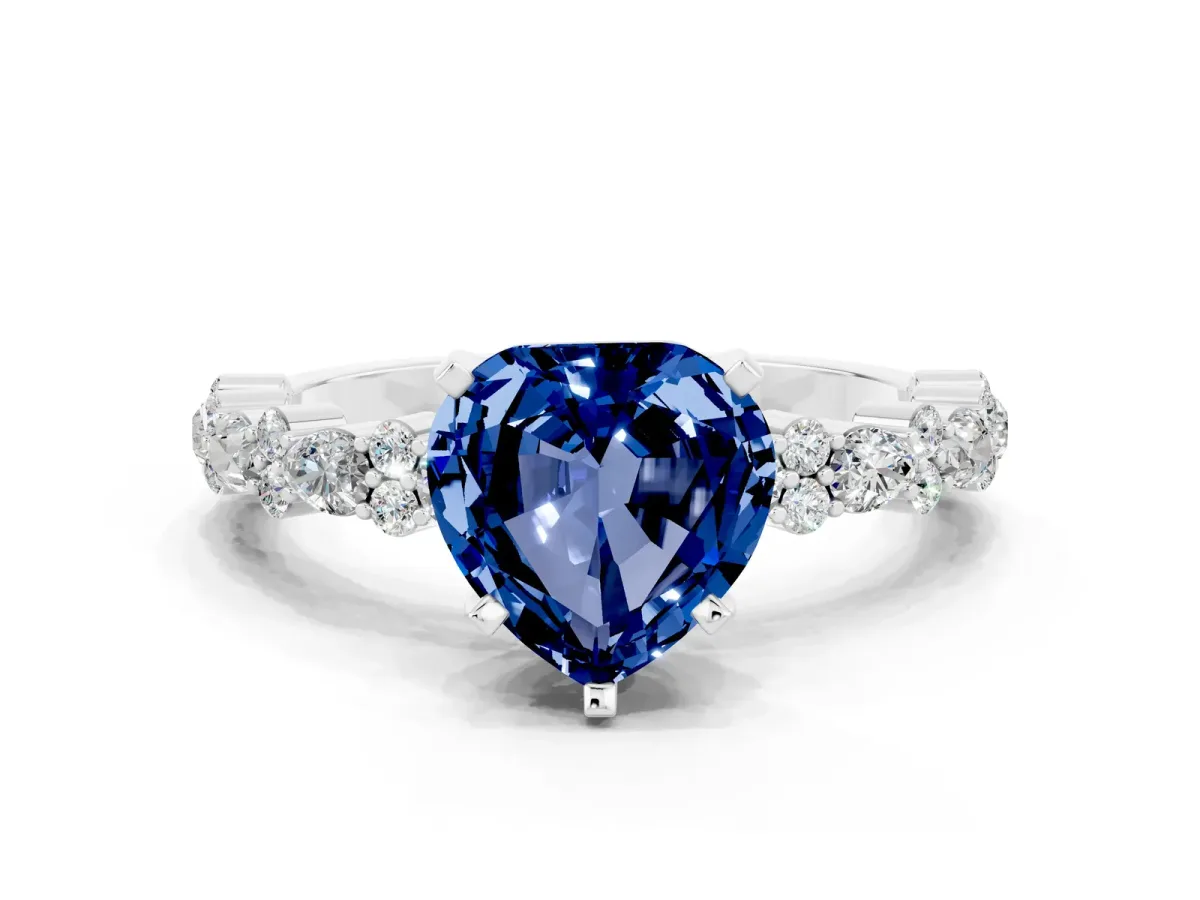 Heart Cut Blue Sapphire Side Stone Solitaire Ring with Round and Four-Prong Setting Platinum