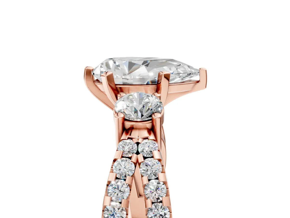 Pear Cut Diamond Three-Stone Ring with Pavé Split Shank and Four-Prong Setting Rose gold