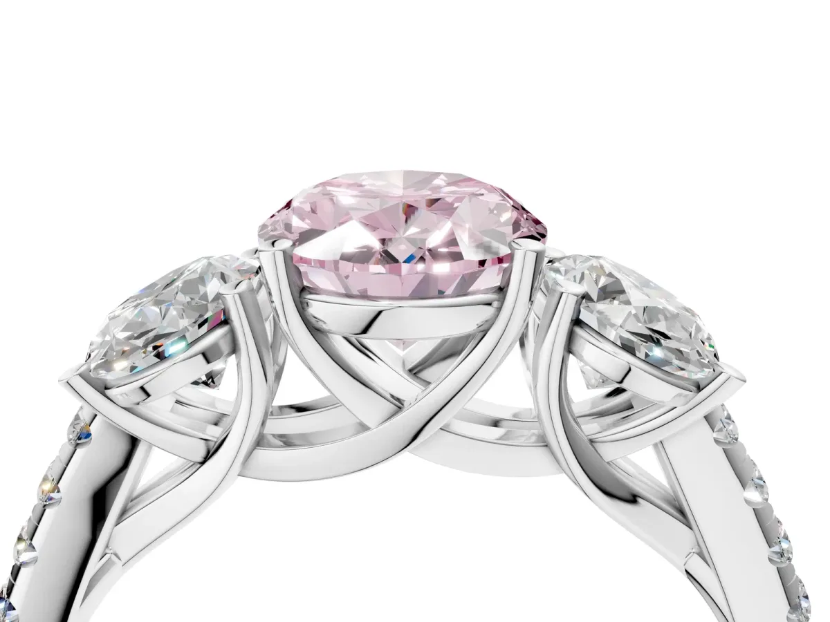 Fancy Pink Three-Stone Oval Cut Diamond Ring with Round Pavé Band and Prong Setting Silver