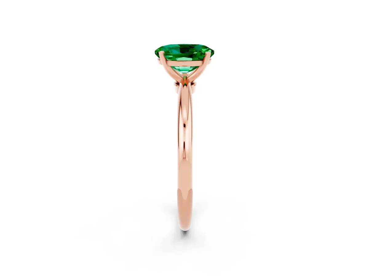 Oval Cut Emerald Solitaire Ring with Six-Prong Setting and Classic Band Rose gold