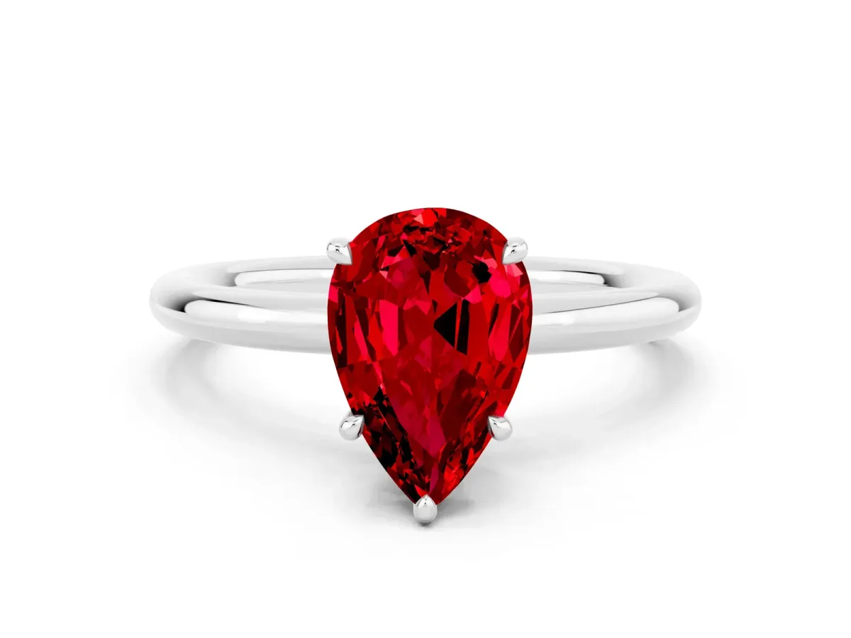Pear Cut Ruby Solitaire Ring with Thin Band and Four-Prong Setting Silver